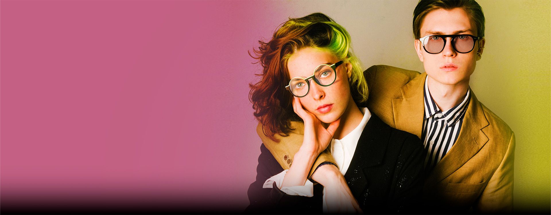 Trendy hipster couple featuring vibrant hair colors and bold glasses, exuding a chic and contemporary vibe.