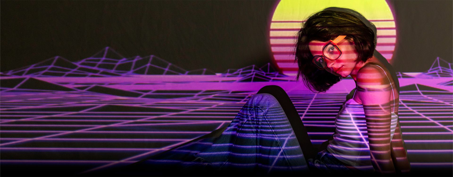 A vaporwave poster of a person in oversized glasses, surrounded by geometric lines and a colorful sunset backdrop.