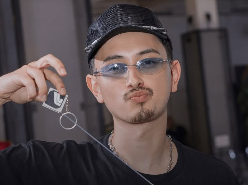 Tombogo wearing limited edition glasses