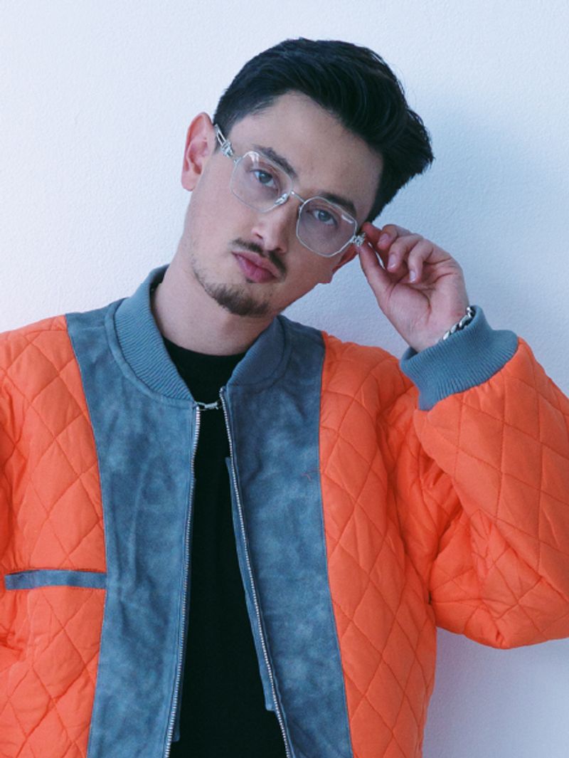 Tombogo wearing limited edition glasses