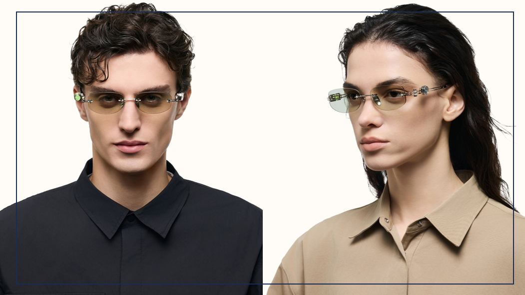 A male and female model both wearing the green-tinted industrial rimless glasses, demonstrating the gender-neutral appeal of the modern 