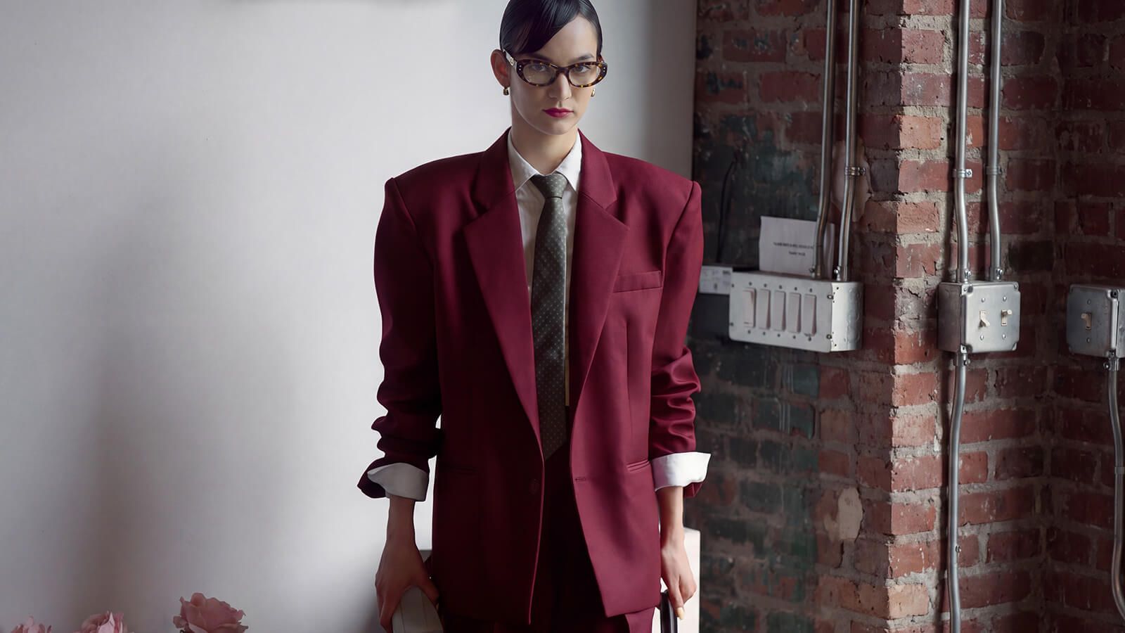 mona with oversized suits and a Tortoise Retro Narrow Cat Eye Glasses