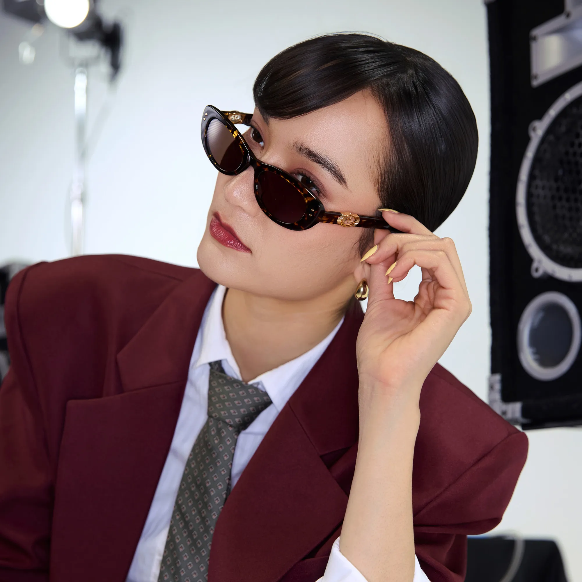 mona matsuoka with oversized suit and tortoise glasses