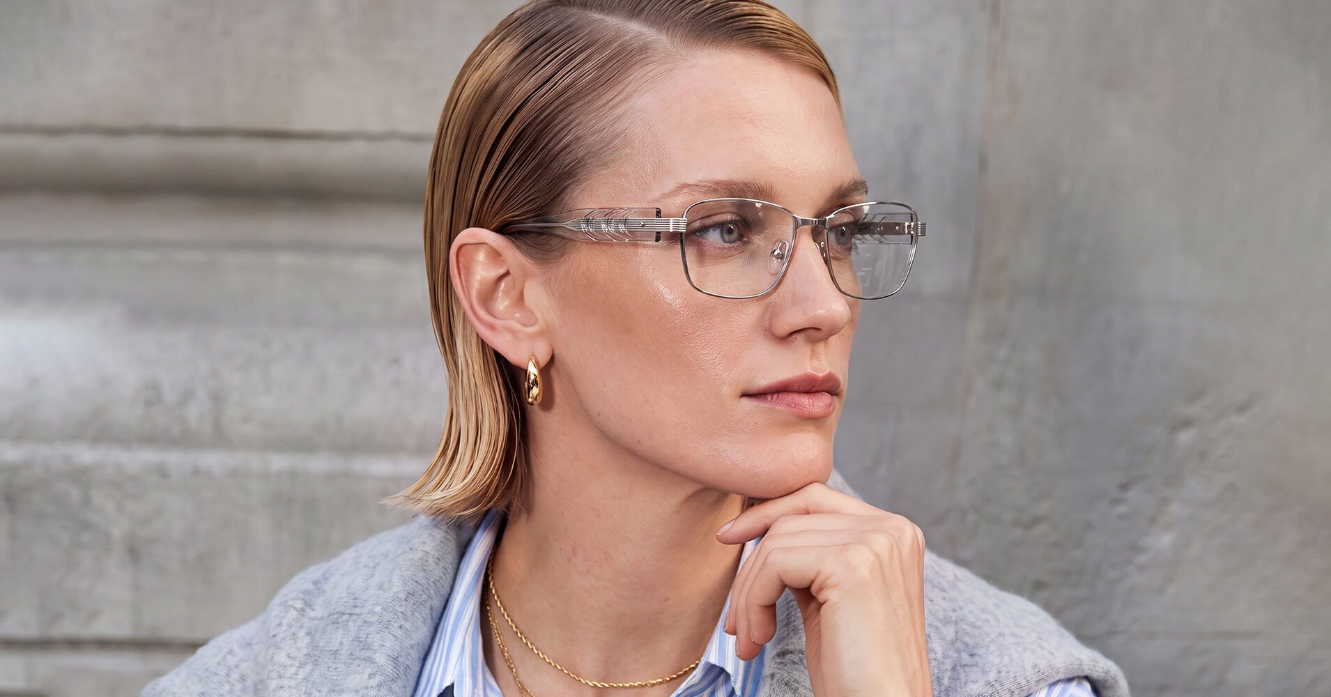 woman with exposed metal pin rectangle silver glasses