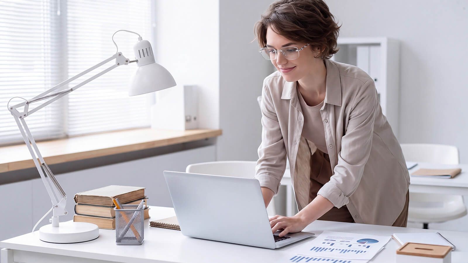 woman with Silver Grey Rimless Spike Glasses when working with laptap