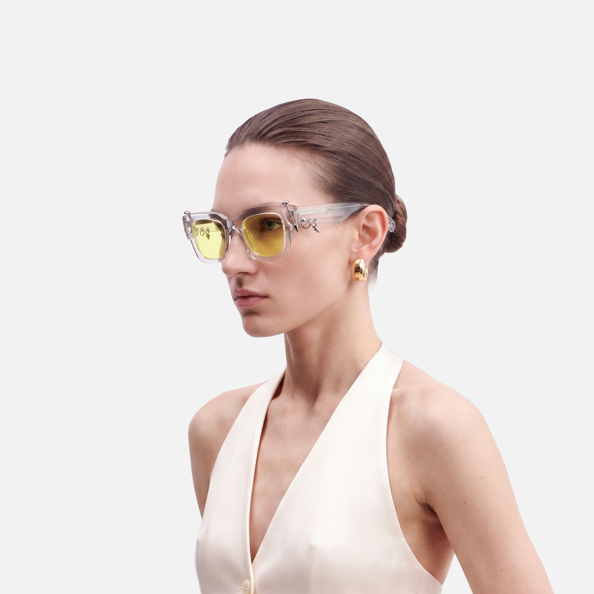 Sabrina - Clear Pierced Yellow Tint Sunglasses by Vooglam - Side View On Model