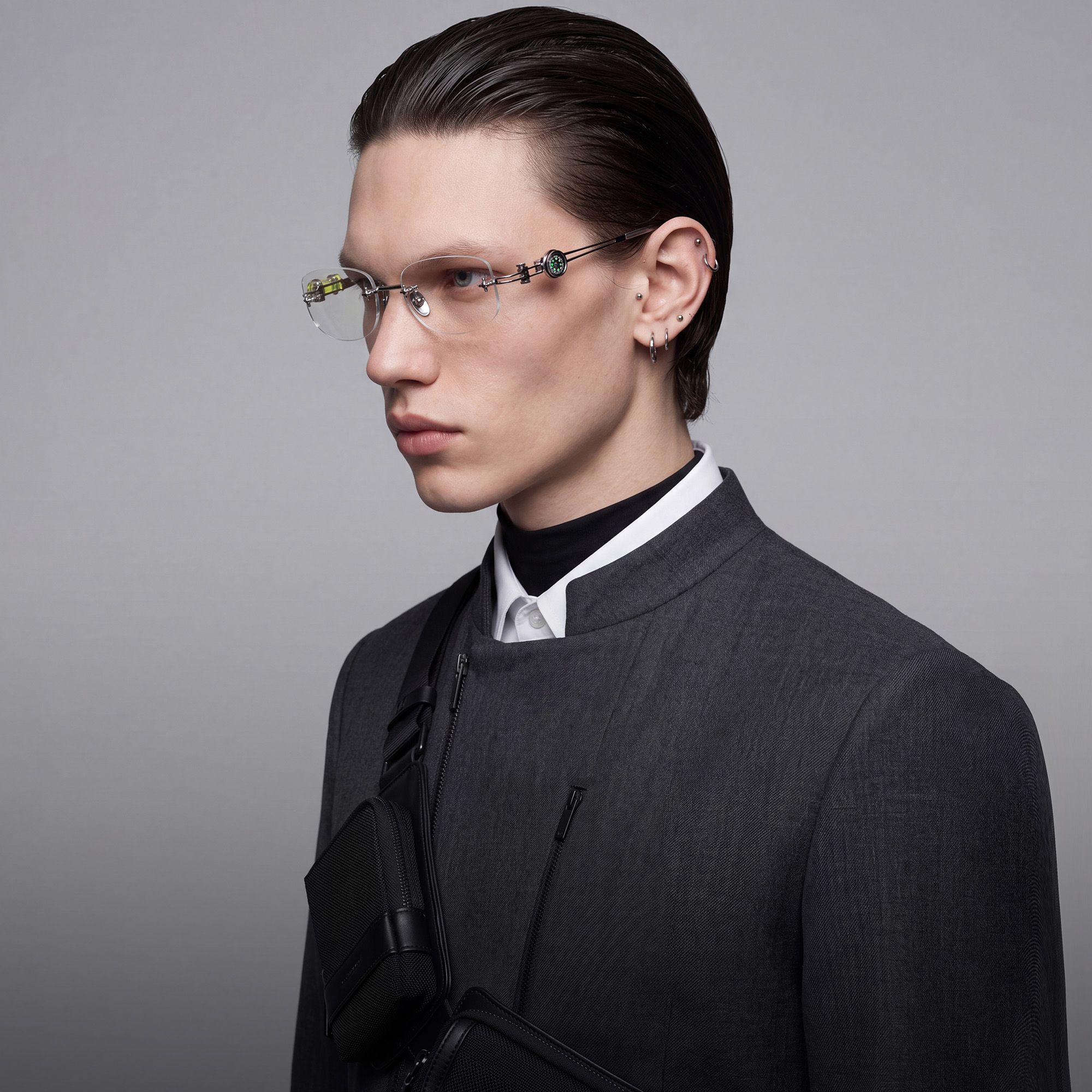 Explore the design story of The Utilitarian - Silver Rimless Compass Glasses | Vooglam