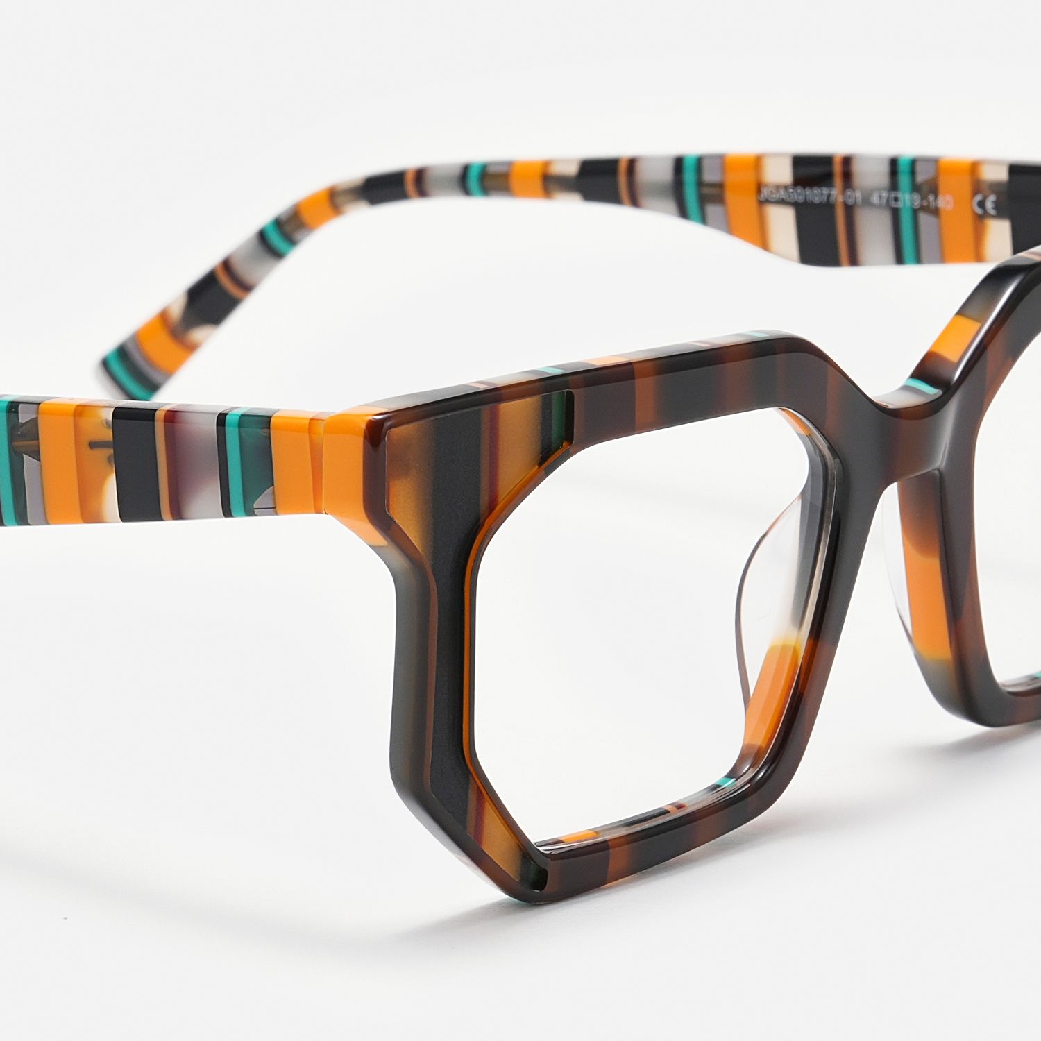 green and amber patterned glasses with metal frames