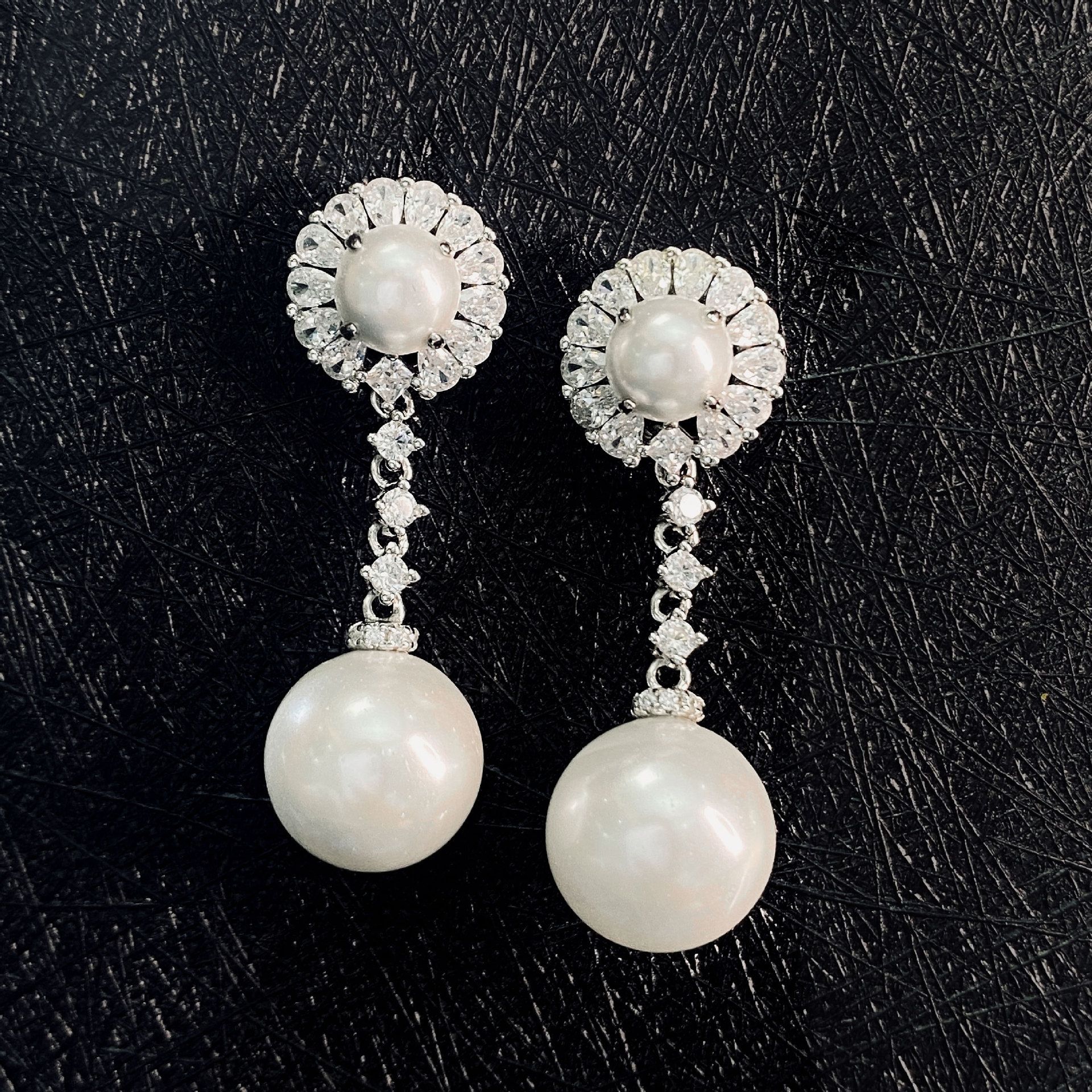 Classic Diamond White Round Pearl Pierced Earrings | Vooglam On Model 1