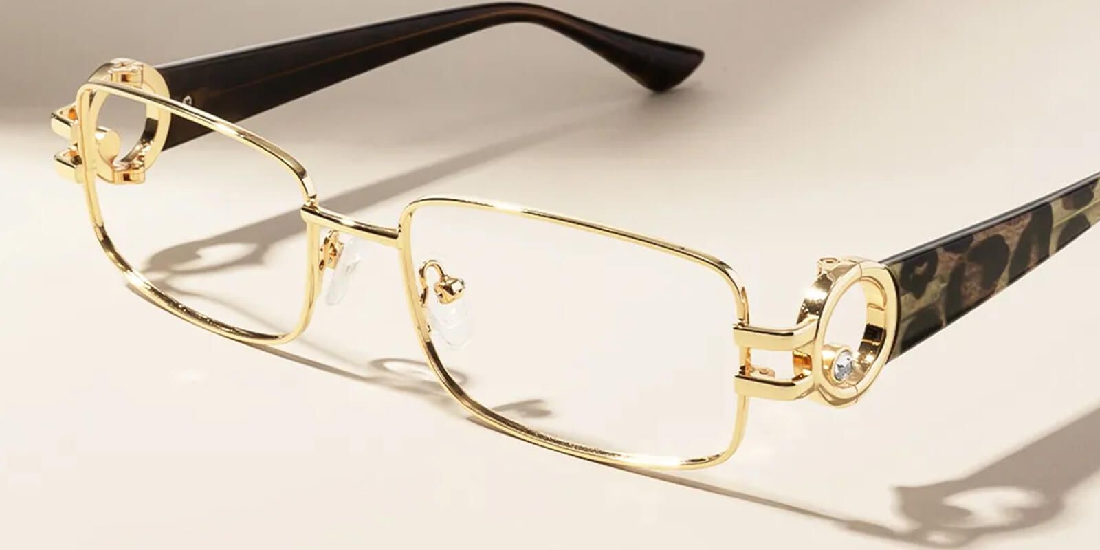 A pair of gold-framed eyeglasses with clear lenses