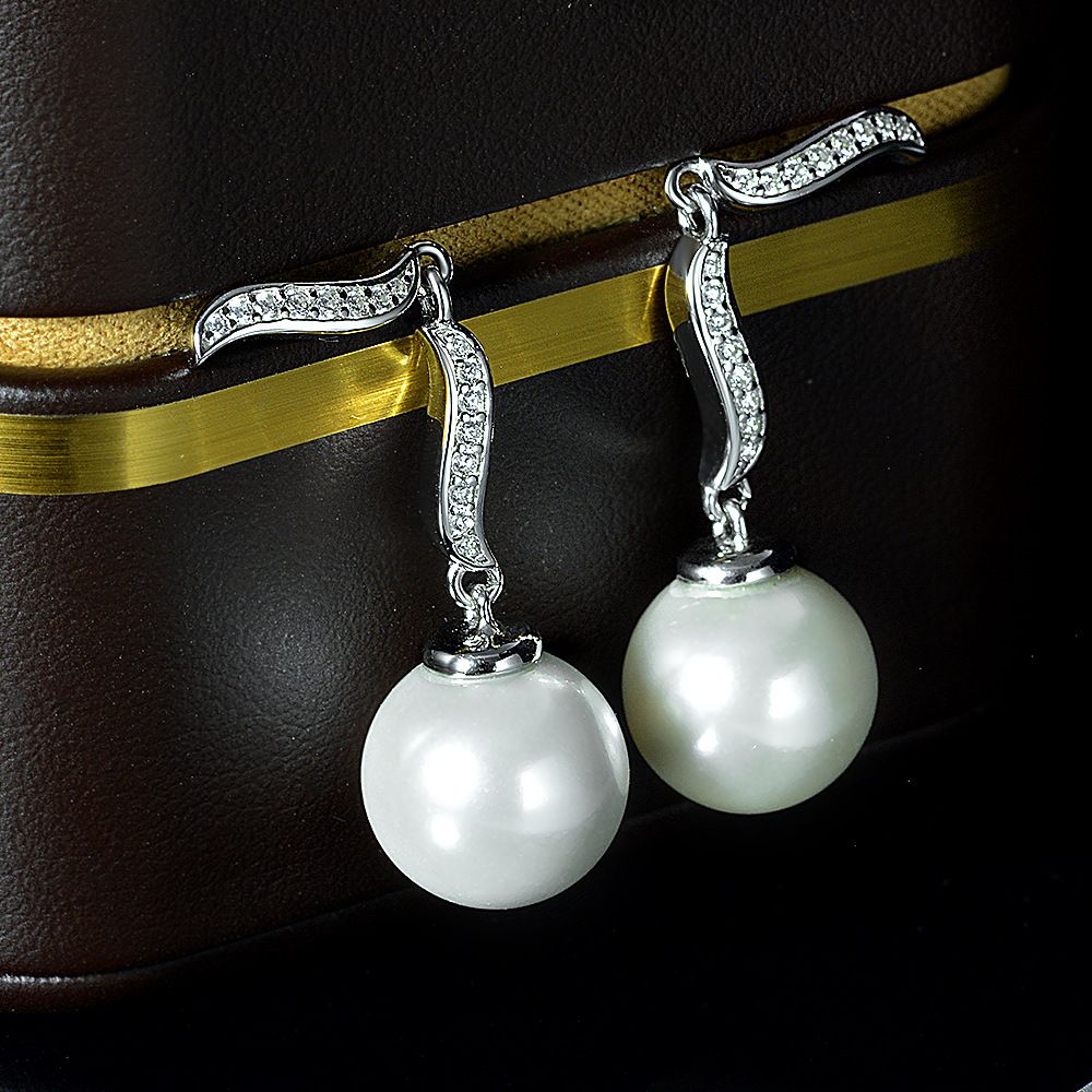 Unique Shiny Diamond White Pierced Earrings by Vooglam - Lifestyle Look