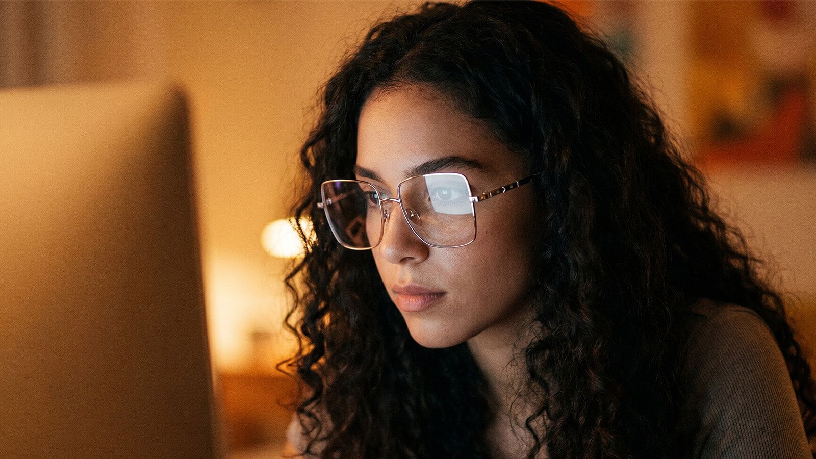 a girl wearing computer-specific progressive when using computer