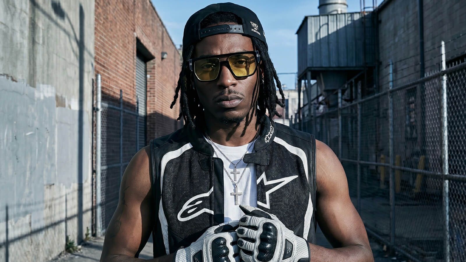 a cyperpunk sporty wearing man with a yellow tinted lenses sunglasses