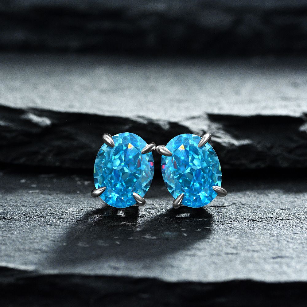 Simple Sapphire Blue Oval Pierced Earrings | Vooglam On Model 1