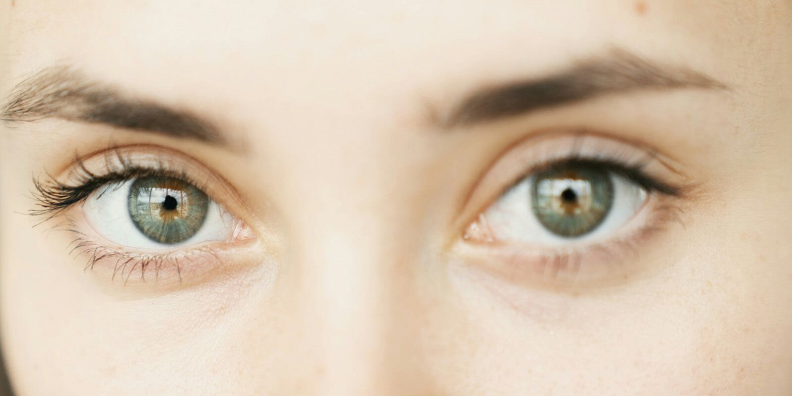 Woman opens her eyes
