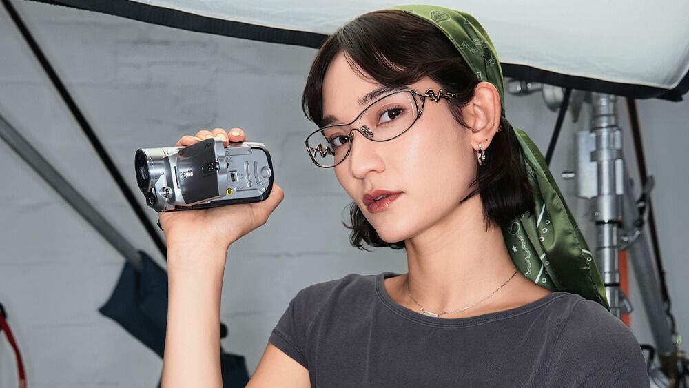 mona matsuoka with pink metal hollow design oval glasses
