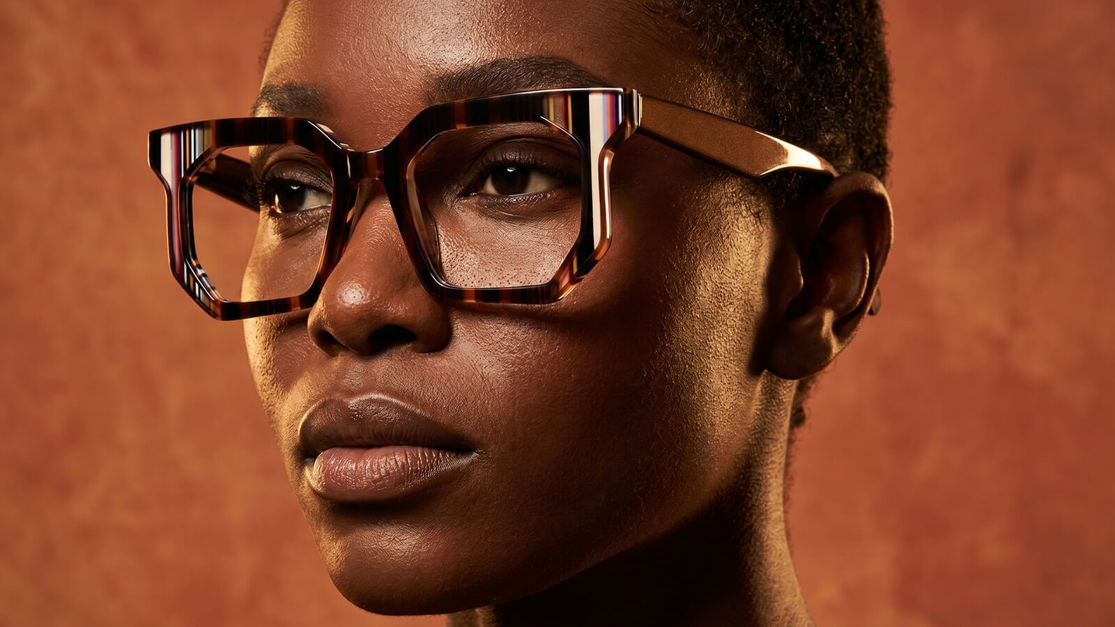 a black man wear bold geometric eyewear