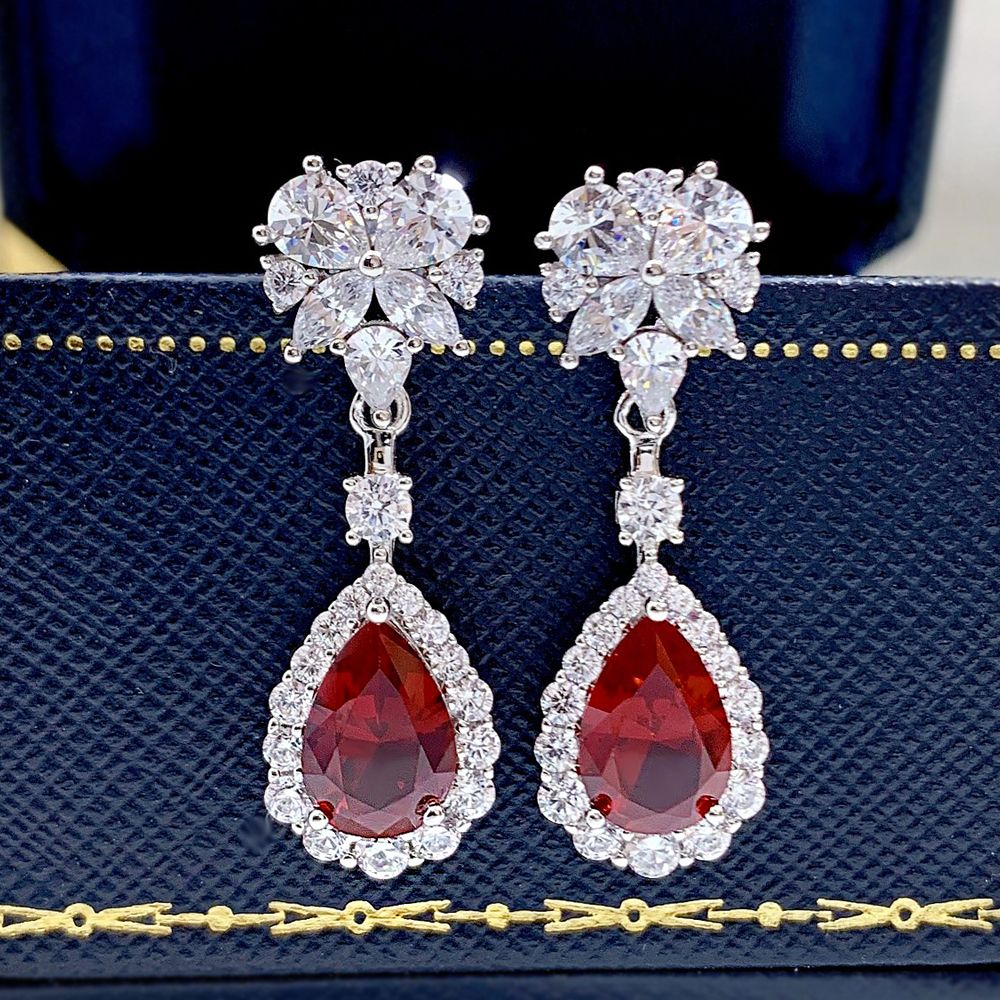 Elegant Ruby Red Waterdrop Pierced Earrings On Model 1