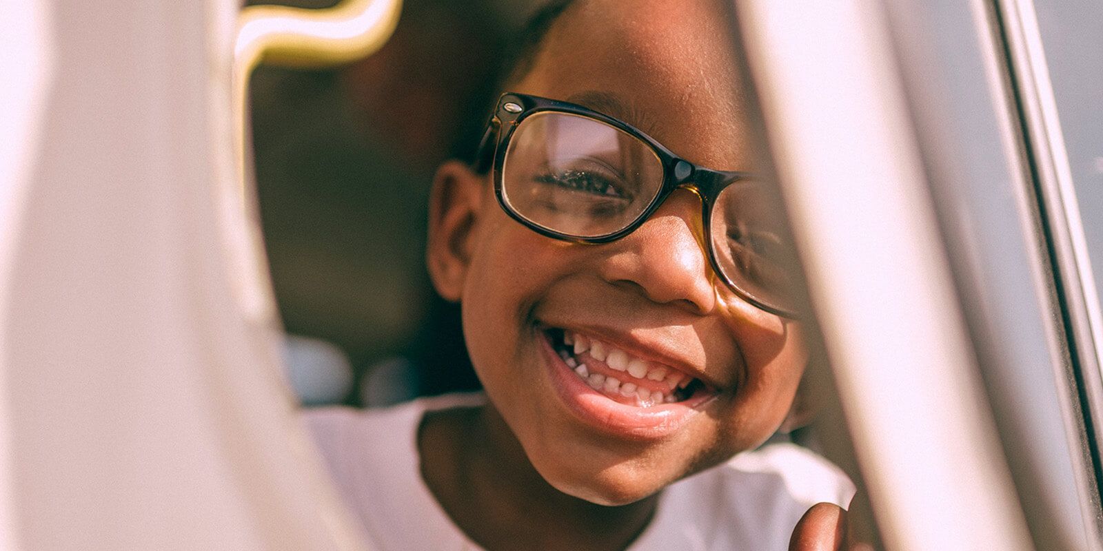Smiling child with glasses