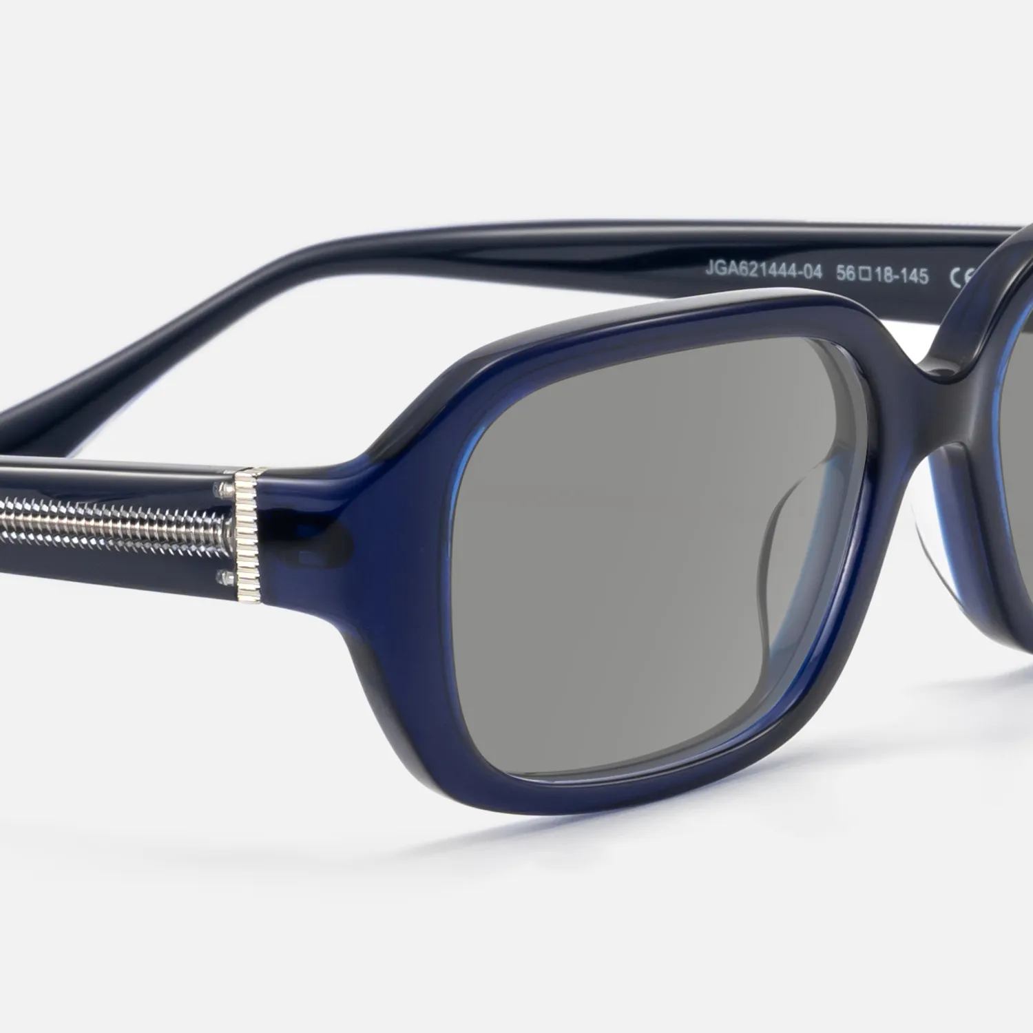 bold deep navy blue glasses with exposed metal pin
