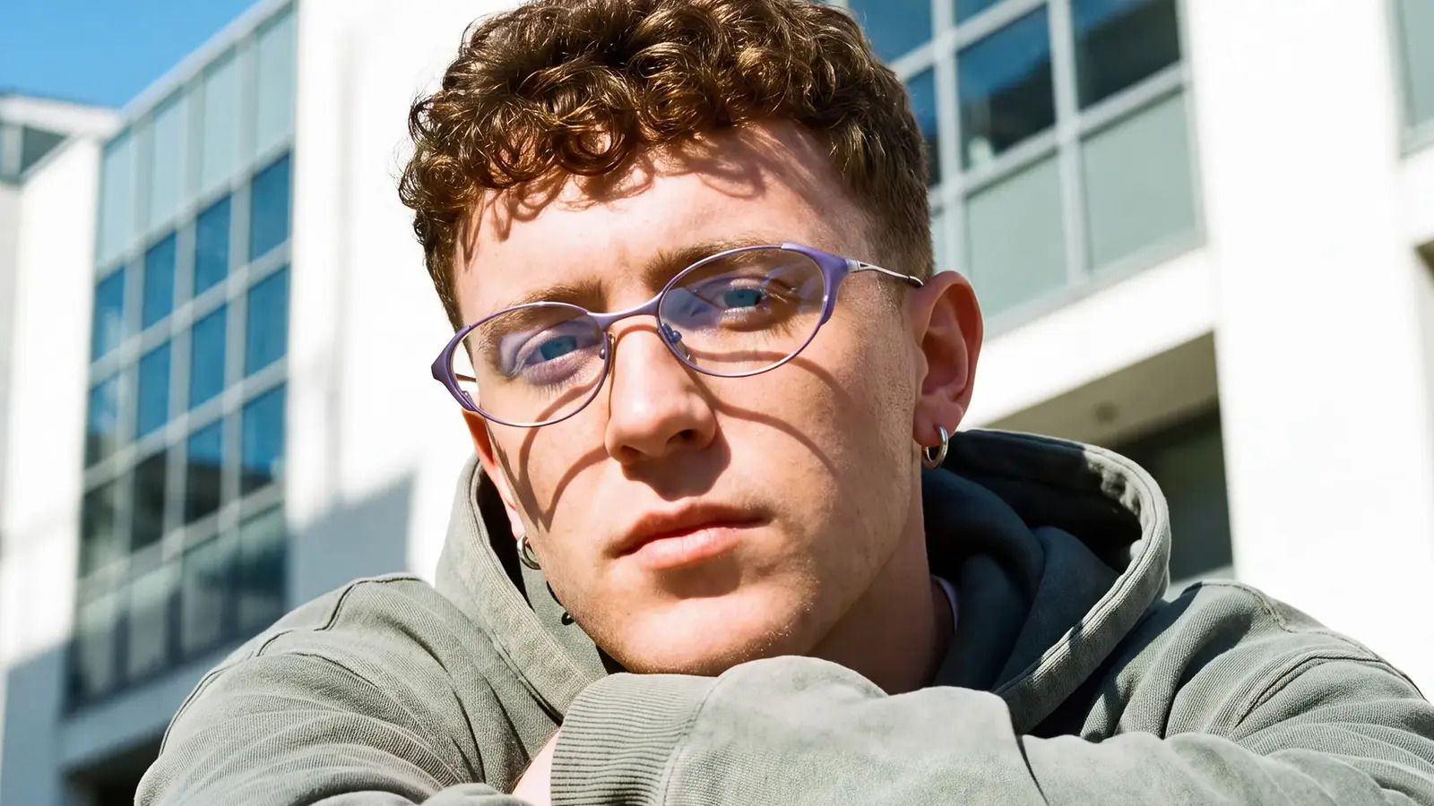 a diamond face shape male wearing slim oval glasses