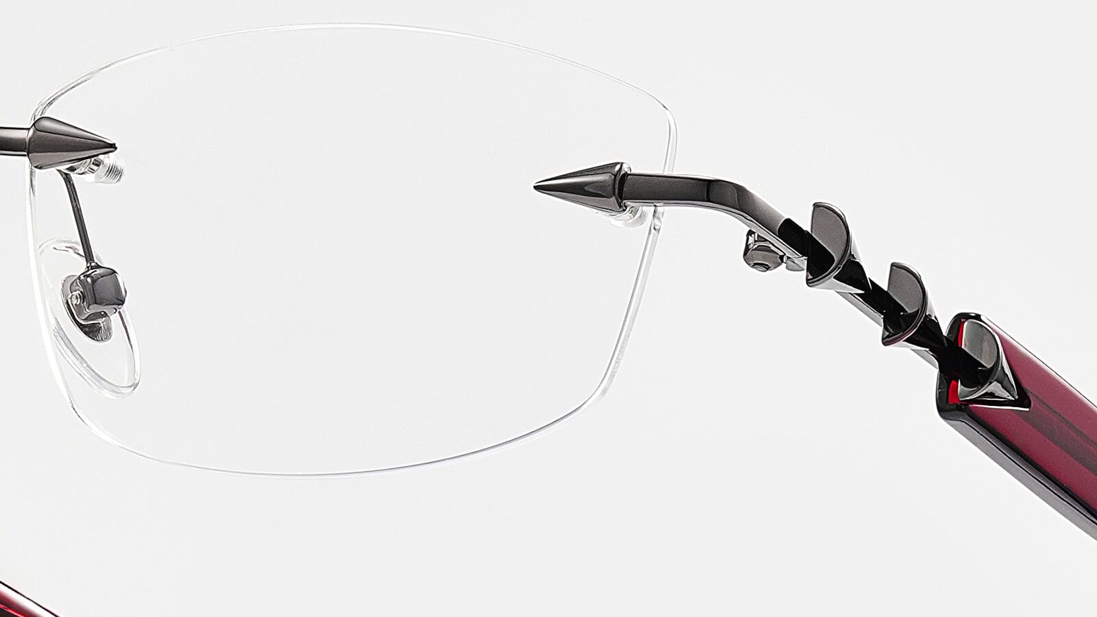 details of a rimless metal glasses hinge