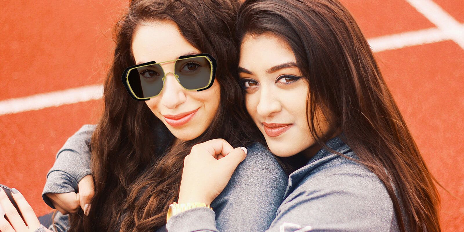 Two girls, one wearing Vooglam sunglasses