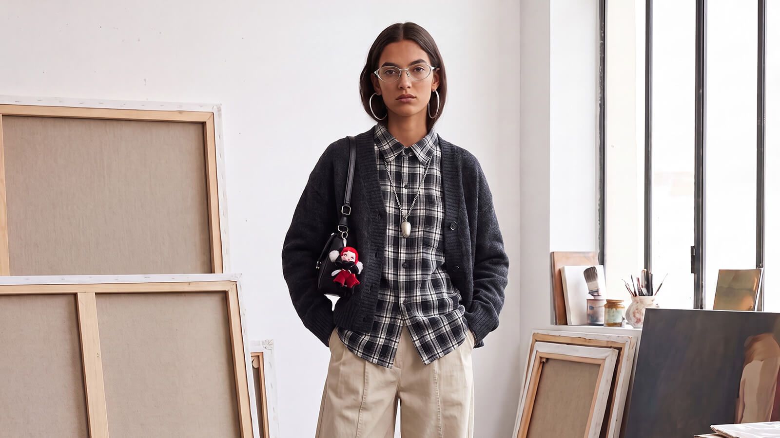 girls with neutral layers shirts and coats with 90s oval wire glasses