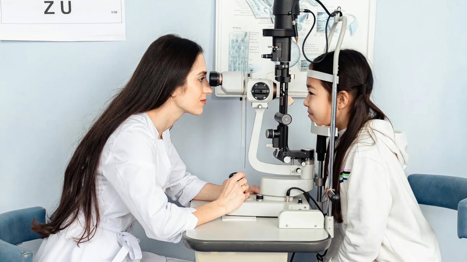 A young optician is testing the child's eyesight