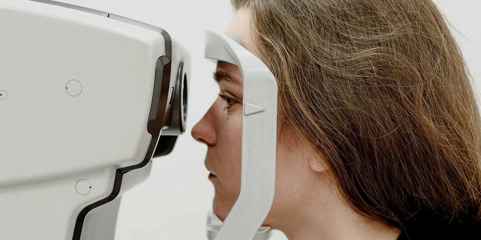 A woman is undergoing optical testing