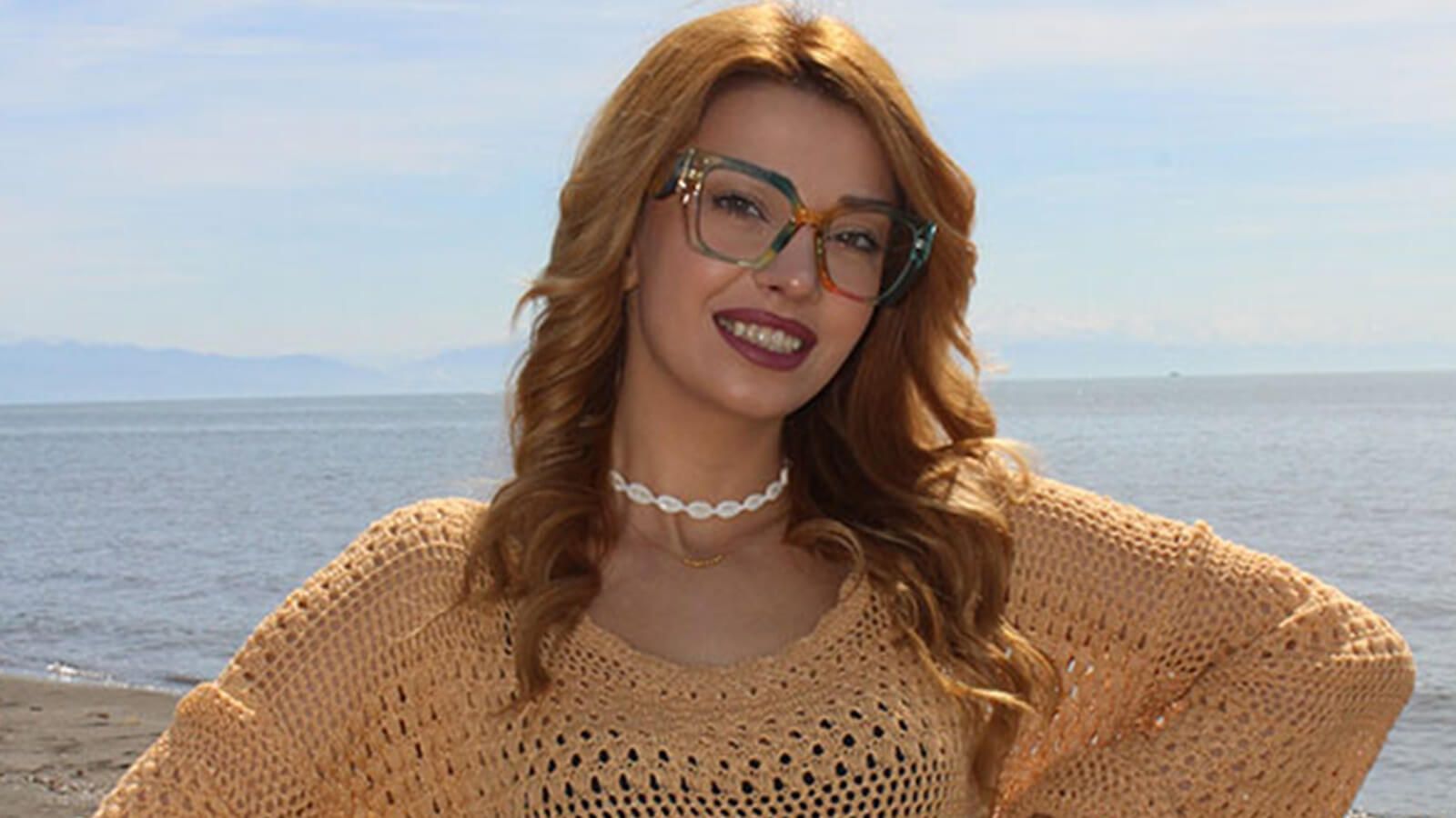 Pretty girl in yellow knitted sweater, blonde hair, brown eyes