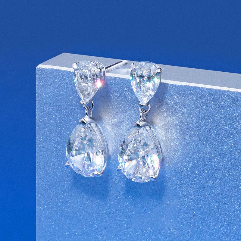 Stylish Diamond White Waterdrop Stud Pierced Earrings by Vooglam - On Model
