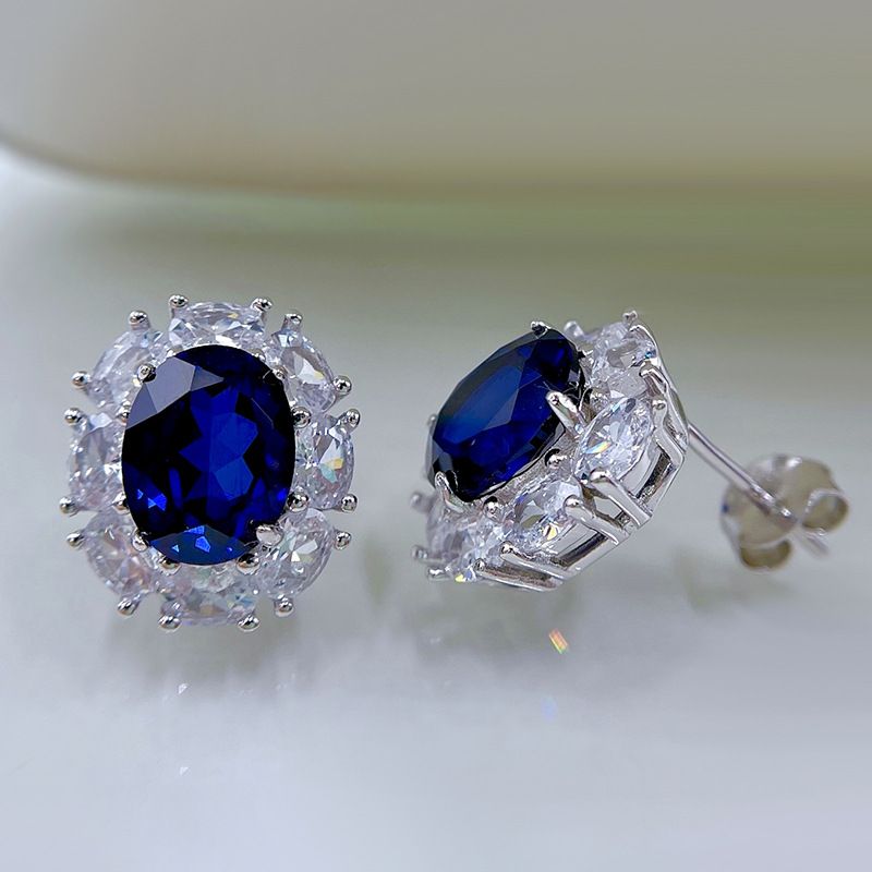 Contemporary Sapphire Blue Oval Pierced Earrings | Vooglam On Model 1