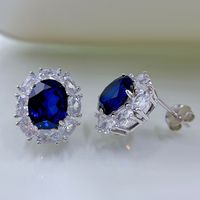Contemporary Sapphire Blue Oval Pierced Earrings | Vooglam On Model 1