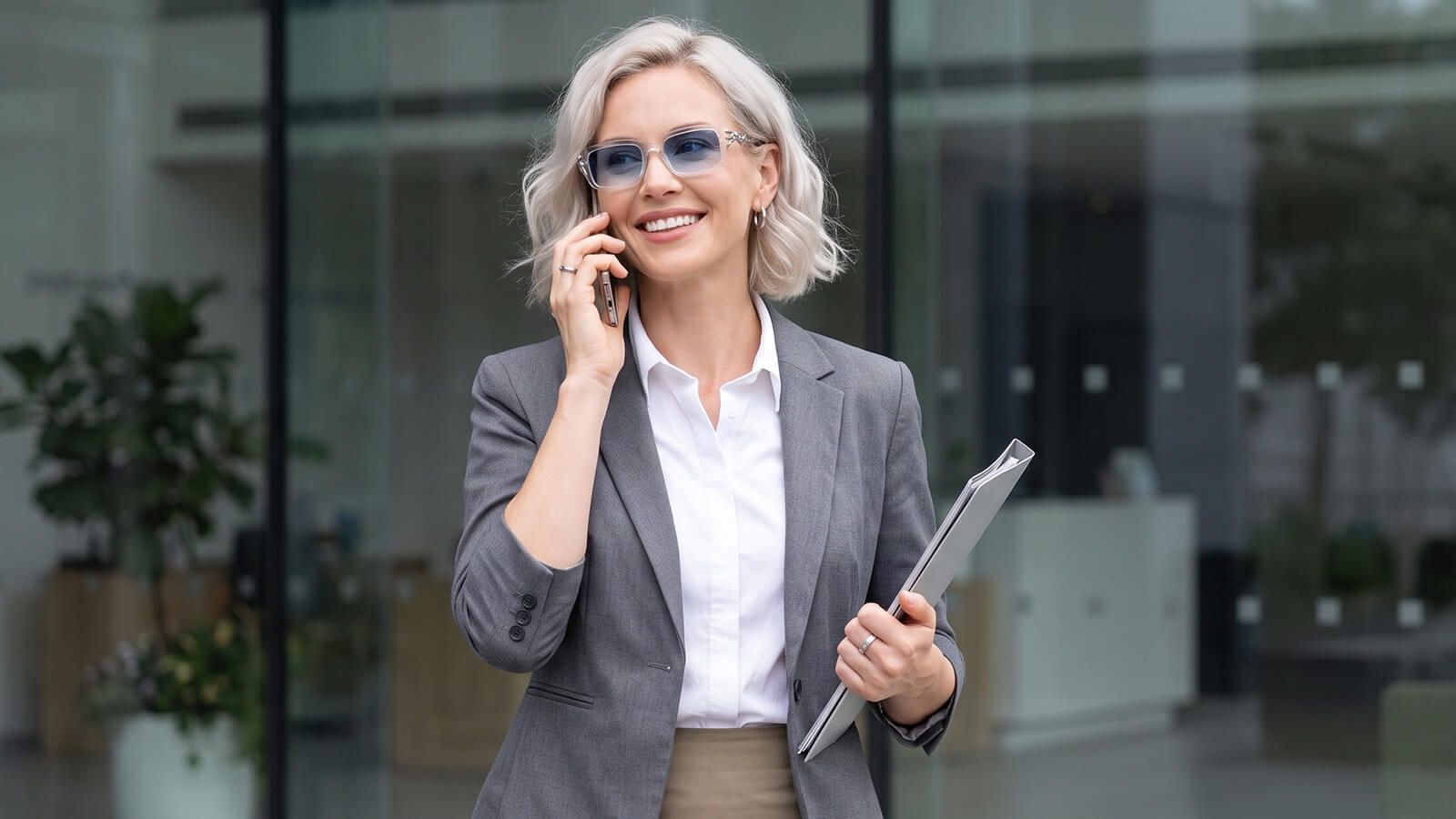 sharp office outfit with a transparent gradient light blue sunglasses