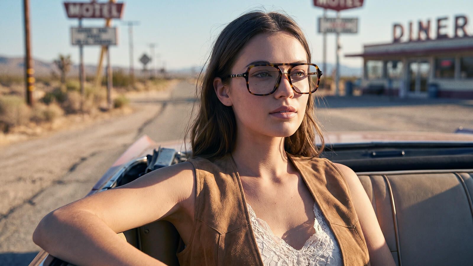 a woman wearing moto boho style outfit with glasses in road trip